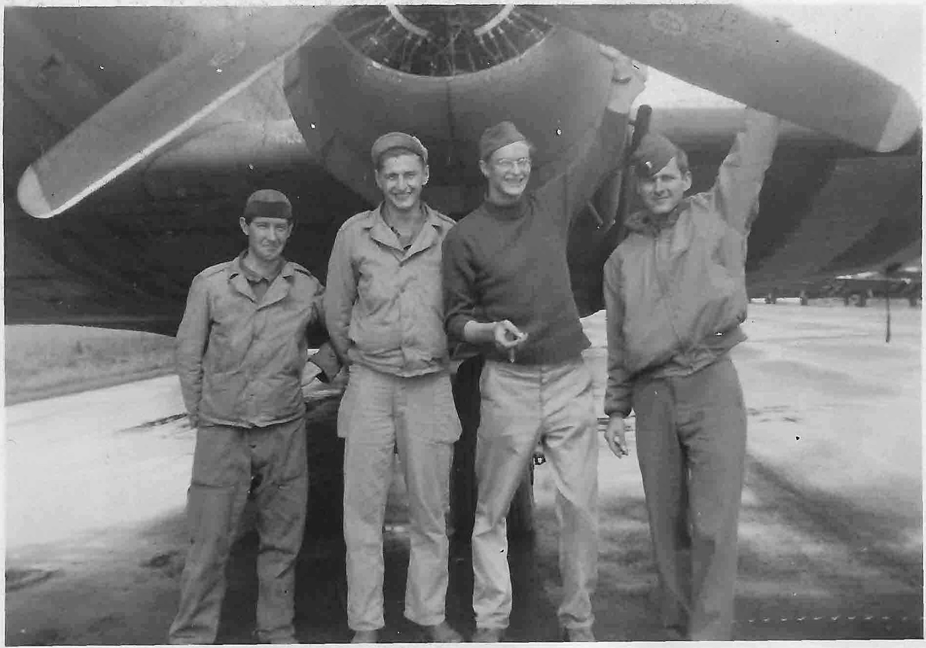 Four men standing in front of an aircraft; Kent Maynard, Kent’s father, at right.